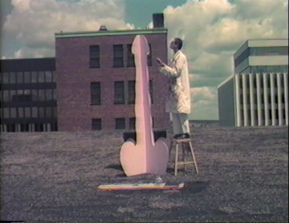 Jim on a stool with giant pink plywood penis